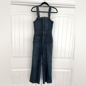 Reformation: denim jumpsuit with zipper detail. Slightly stretchy denim.